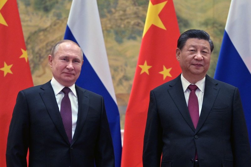Russian President Vladimir Putin (L) and Chinese President Xi Jinping (R) pose for a picture during their meeting in Beijing on February 4. Kremlin Pool Photo by Alexei Druzhinin/Sputnik/EPA-EFE
