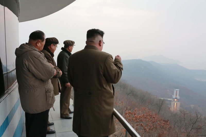 North Korean leader Kim Jong-un (R) watches the test of a high-thrust rocket engine March 18 at the Sohae satellite launching facility in North Pyongan Province. On Sunday, North Korea launched its eighth missile test this year. Photo by North Korean Central News Agency/EPA