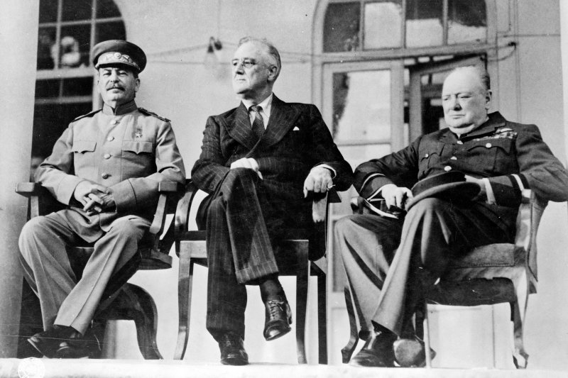 On December 1, 1943, ending a "Big Three" meeting in Tehran, U.S. President Franklin Roosevelt, British Prime Minister Winston Churchill and Russian Premier Josef Stalin pledged a concerted effort to defeat Nazi Germany. File Photo by Library of Congress/UPI