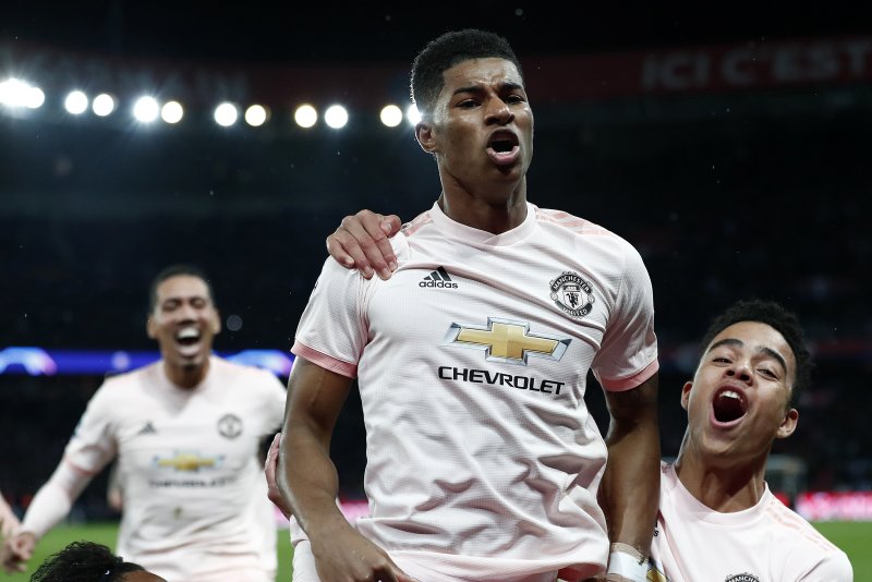 Manchester United's Marcus Rashford (C) celebrates scoring the 3-1 lead during the UEFA Champions League round of 16 second leg soccer match between PSG and Manchester United on Wednesday at the Parc des Princes Stadium in Paris, France. Photo by Ian Langsdon/EPA-EFE