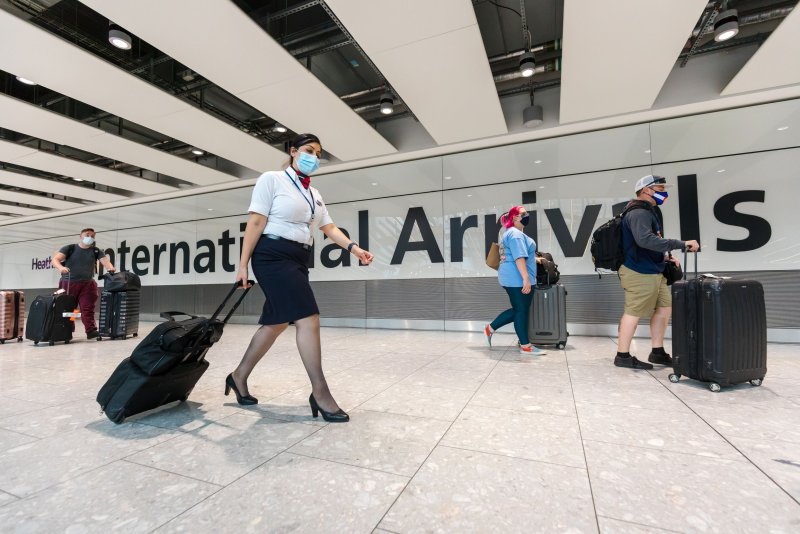 Passengers arrive at Heathrow Airport in London on August 2, as the United Kingdom reopened to travelers vaccinated against COVID-19. File Photo by Vickie Flores/EPA-EFE