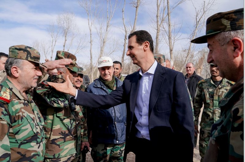 The United States and Canada on Monday marked the 10th anniversary of a chemical attack on civilians by the Syrian regime that killed hundreds near Damascus. The United States has blamed the government of Syrian ruler Bashar al-Assad (pictured greeting Syrian troops in Ghouta, in 2018) for the chemical attack in 2013. Photo by Syrian Arab News Agency for EPA-EFE