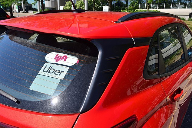 Lyft and Uber logos are shown on a car. The European Commission proposed a directive Thursday that could turn gig workers for ride-share companies and others into employees. File Photo by Raysonho/Wikimedia/UPI