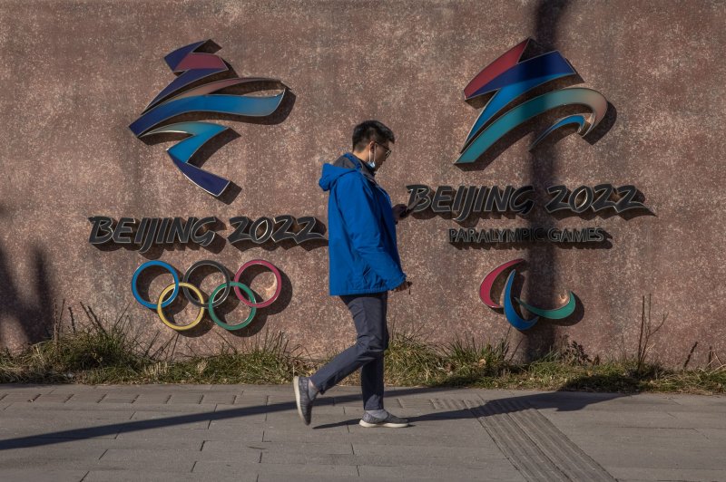 A man walks past the headquarters of the 2022 Beijing Winter Olympics in December. Officials in Beijing said Saturday that the Chinese capital has recorded its first case of the Omicron variant ahead of the Lunar New Year and the opening of the Winter Olympics.&nbsp;Photo by Roman Pilipey/EPA-EFE