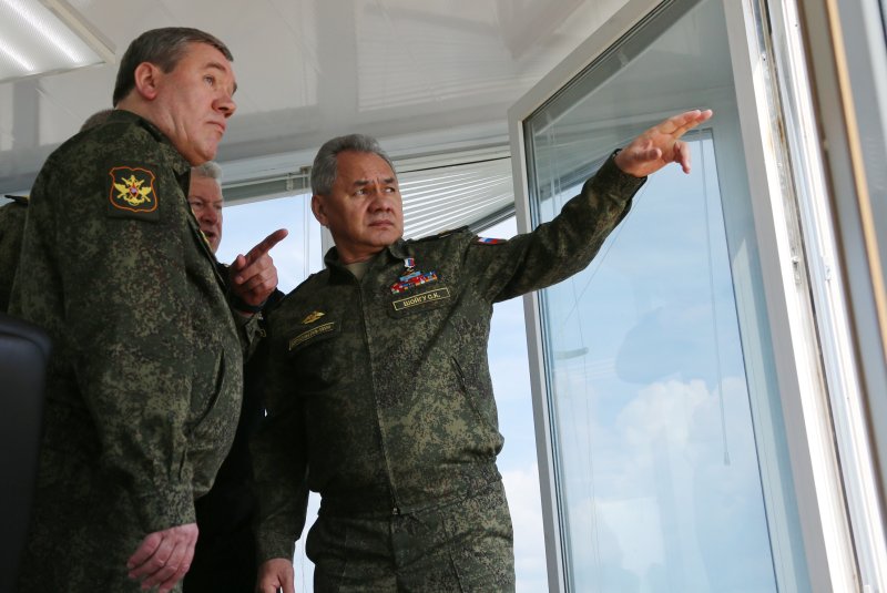 Russian defense minister Gen. Sergei Shoigu (R) and Chief of Russian General Staff Valery Gerasimov are seen during military exercises at the at Opuk range in Crimea on April 22. File Photo by Vadim Savitsky/Russian Ministry of Defense/EPA-EFE