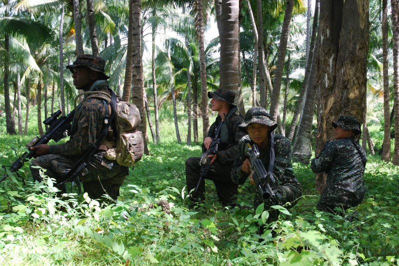 U.S. Marines and Philippine Marines secure a perimeter during an amphibious beach assault July 3, 2012, as part of a series of bilateral military exercises between the U.S. Navy and the armed forces of Bangladesh, Brunei, Cambodia, Indonesia, Malaysia, the Philippines, Singapore and Thailand. The Abu Sayyaf militant Islamist organization based in the Philippines, which is allied to the Islamic State, is accused of carrying out a recent kidnapping of three Indonesian sailors. File Photo by Aaron Glover/U.S. Navy/UPI