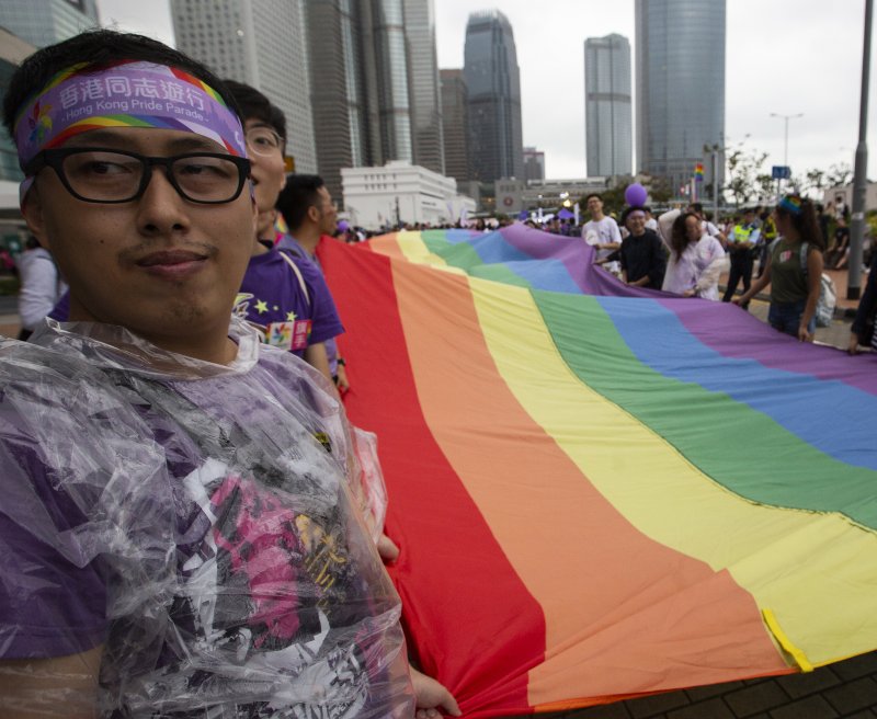 Marchers participate in Hong Kong's gay pride parade last November.&nbsp;A court ruled Thursday that a Hong Kong man can get spousal benefits for his husband.&nbsp; File Photo by Alex Hofford/ EPA-EFE&nbsp;