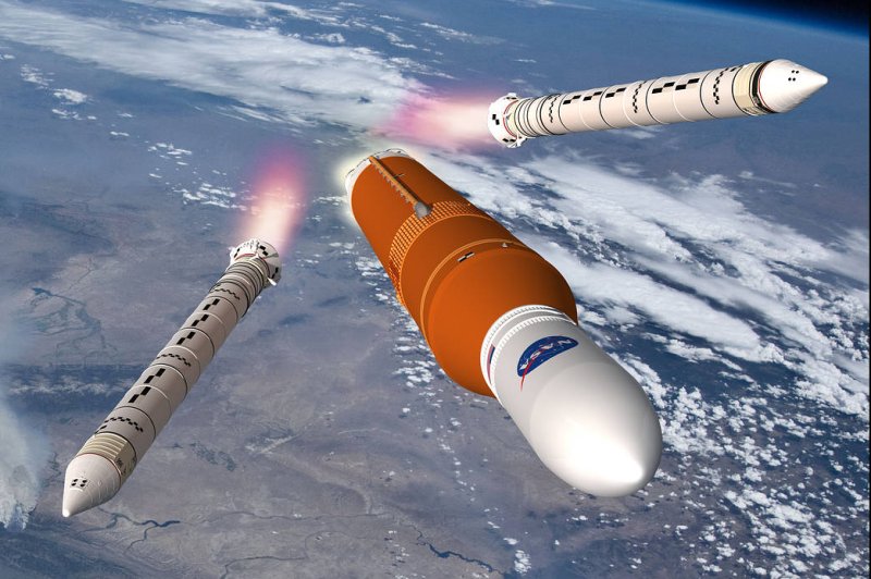 An illustration depicts NASA's SLS moon rocket shortly after launch from Florida as boosters separate. Image courtesy of NASA