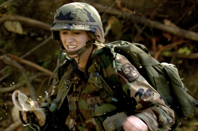 Reserve Officer Training Corps (ROTC) cadet Erin Fahey of Western Michigan University makes her way across a stream during the 2007 Army ROTC Ranger Challenge Competition held at Camp Atterbury, Ind., Oct 20, 2007. The U.S. Army is testing a program to allow women to enroll in Ranger School. Photo courtesy of the U.S. Army.