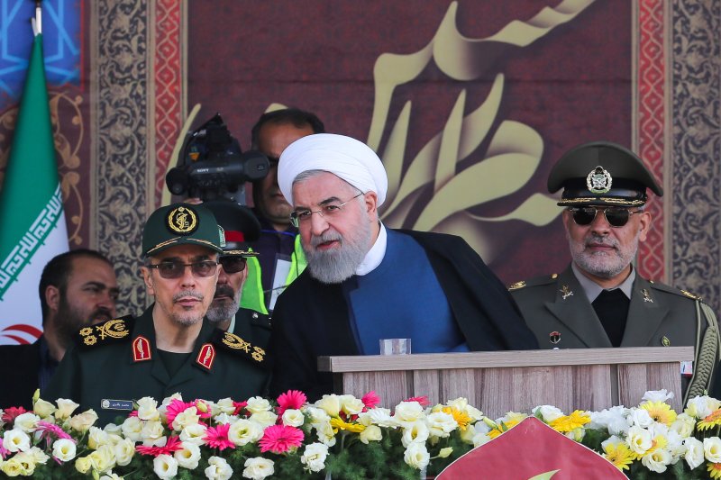 Iranian President Hassan Rouhani warned the United States and other nations to keep military forces away from the nation during a military parade on Sunday. Photo courtesy Iranian President Office/EPA