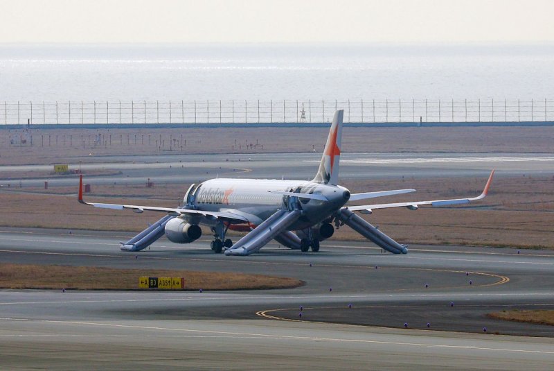 A Jetstar Japan aircraft is seen after making an emergency landing at Central Japan International Airport Saturday after officials received a bomb threat. Photo by Jiji Press/EPA-EFE