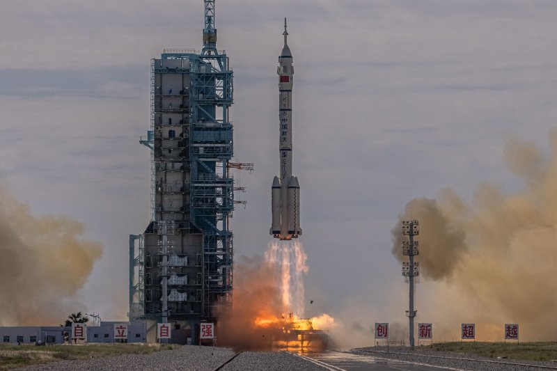 The Long March-2F carrier rocket, carrying the Shenzhou-12, takes off from the launch site at the Jiuquan Satellite Launch Center, in the Gobi Desert, Inner Mongolia, near Jiuquan, China, on Thursday. Photo by Roman Pilipey/EPA-EFE