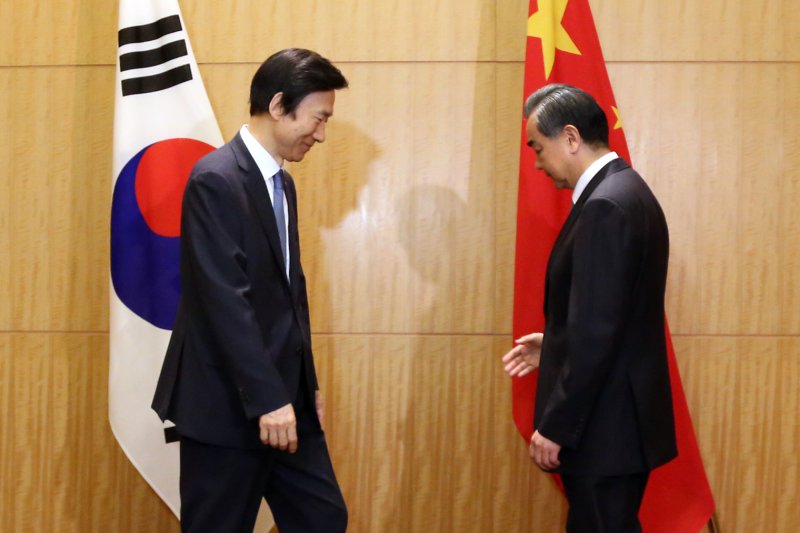 South Korean Foreign Minister Yun Byung-se (L) meets with Beijing’s Foreign Minister Wang Yi in Tokyo, Japan on Aug. 24, 2016. Wang has voiced his opposition to a joint U.S.-South Korea decision to deploy THAAD, and an editorial in the Global Times issued another warning to Seoul on Monday. Photo by Yonhap News Service/UPI