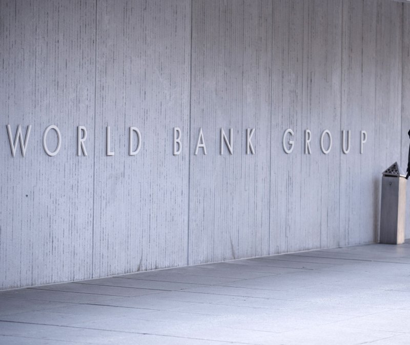 A pedestrian walks in front of The World Bank Group building in Washington, D.C., on April 18, 2018. The World Bank warned of global stagflation in its latest report on Tuesday. File Photo by Shawn Thew/EPA-EFE