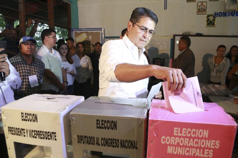 Honduras President Juan Orlando Hernandez casts his ballot at a polling station in Gracias, Honduras. Photo by Artido/EPA