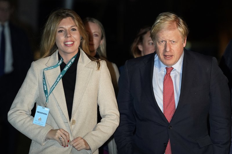 British Prime Minister Boris Johnson (R) married Carrie Symonds on Saturday. File Photo by Will Oliver/EPA-EFE