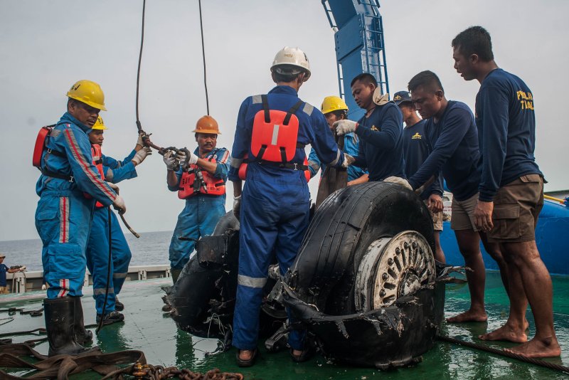Indonesian rescuers lift recovered wheels from Lion Air Flight 610 on a rescue ship in the waters off Karawang, West Java, Indonesia, on Sunday. Photo by Fauzy Chaniago/EPA-EFE
