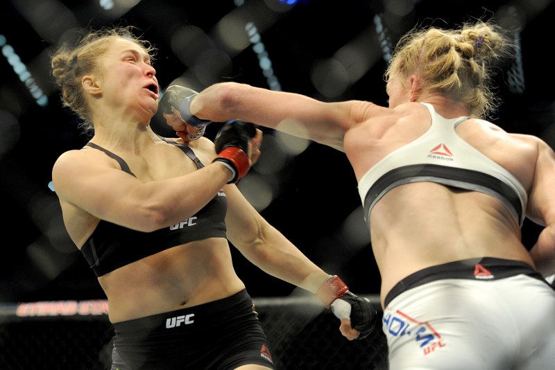 Holly Holm (R) strikes defending champion Ronda Rousey (L) in the Women's Bantamweight Bout during the UFC 193 Australia event on Nov. 15, 2015 at Etihad Stadium in Melbourne. Rousey, 30, has lost two consecutive fights and is now working as an actress. File Photo by Joe Castro/EPA