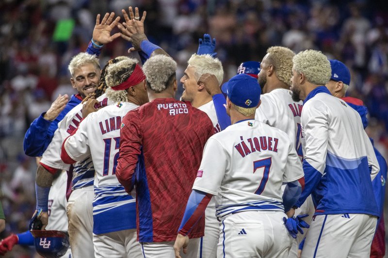 Puerto Rico players celebrate a combined, walk-off perfect game against Israel at the 2023 World Baseball Classic on Monday in Miami. Photo by Cristobal Herrera-Ulashkevich/EPA-EFE