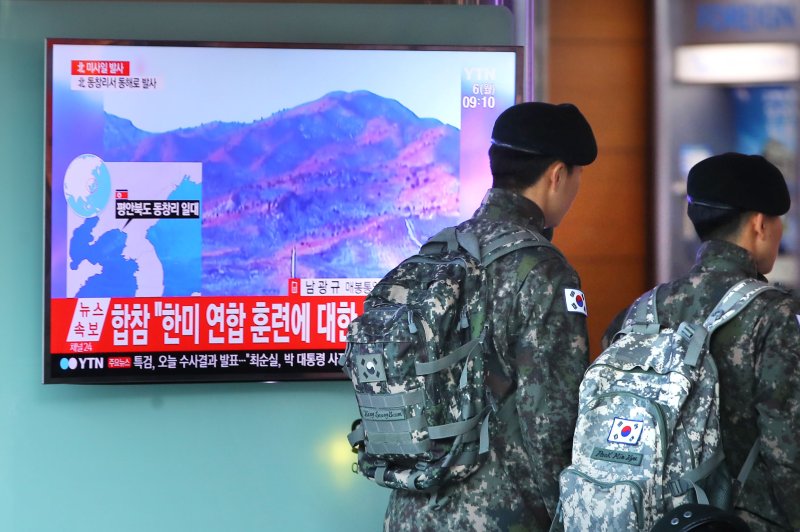 South Korean soldiers walk past a TV broadcasting North Korea's launch of several ballistic missiles into the East Sea at Seoul Station on March 6. North Korea could be preparing for its next nuclear test, but it could lead to a disaster that precipitates the collapse of the Kim Jong Un regime, a North Korean defector said Tuesday. Photo by Yonhap News Agency/UPI