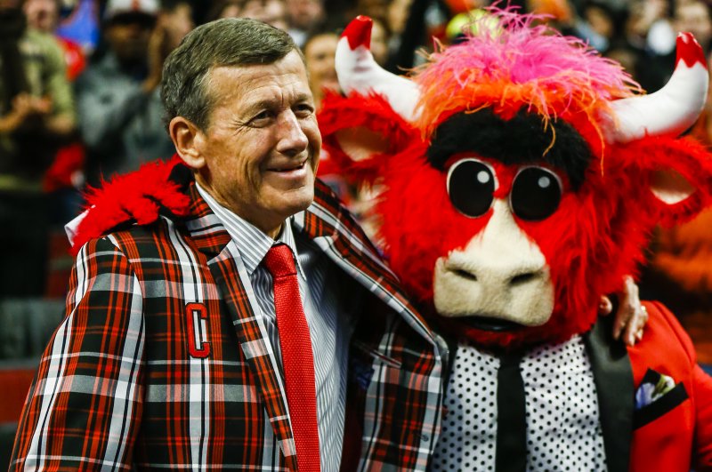 NBA basketball sideline reporter Craig Sager, known for his bright suits, shoes and ties, wears a new sport coat given to him by Chicago Bulls mascot Benny the Bull during a game at the United Center in Chicago, Illinois,in March. Sager died on Thursday of complications from a rare form of leukemia. He was 65. File Photo by Tannen Maury/European Pressphoto Agency