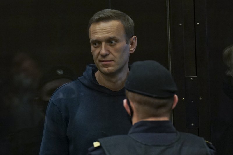 Russian opposition leader Alexei Navalny stands in a glass cage during a hearing in the Moscow City Court in Moscow, Russia, on February 2, 2021. On Monday, Navalny was forcibly removed from his prison cell after he refused to leave in protest over jail guards confiscating his writing tools. File Photo courtesy of the Moscow City Court Press Service