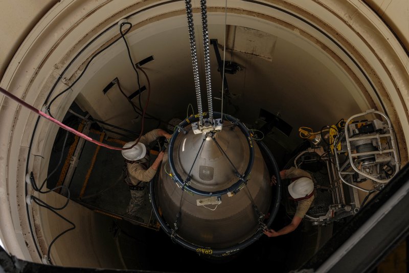 Airmen from the 90th Missile Maintenance Squadron prepare a reentry system for removal from a launch facility in February 2018 in the F. E. Warren Air Force Base missile complex. The 90th MMXS is the only squadron on F. E. Warren allowed to transport warheads from the missile complex back to base. Photo by Airman 1st Class Braydon Williams/U.S. Air Force