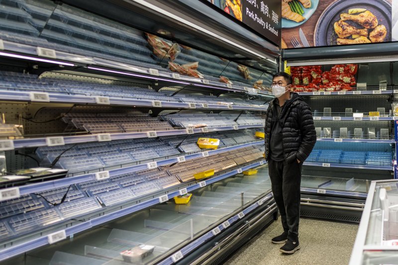 Residents of Shanghai scrambled to stock up on groceries and other necessities as the government announced the city will lock down in two phases beginning Monday. Photo by Alex Plavevski/EPA-EFE