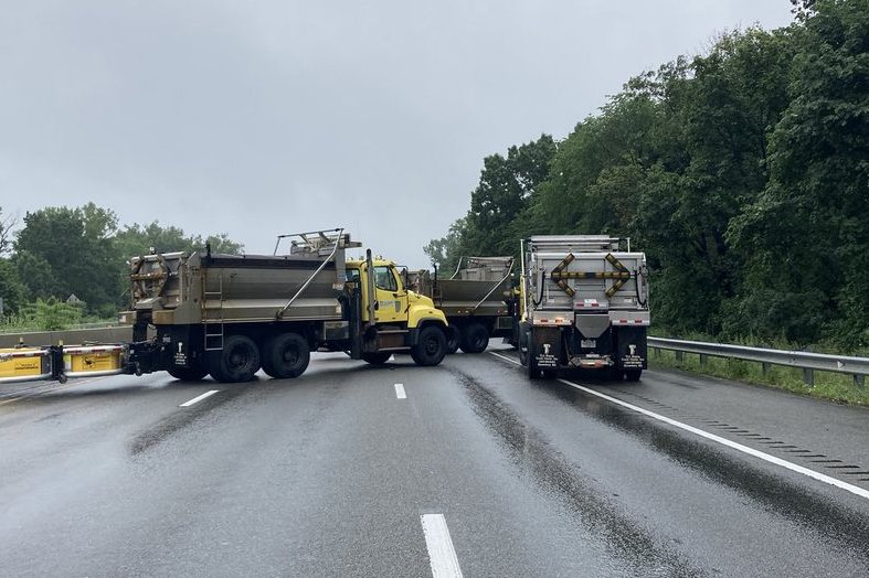 The Massachusetts Dept. of Transportation provided heavy trucks to secure Interstate 95 on Saturday during a standoff near Wakefield, Mass. Police arrested 11 armed suspects in the incident. Photo by Massachusetts State Police / TWITTER