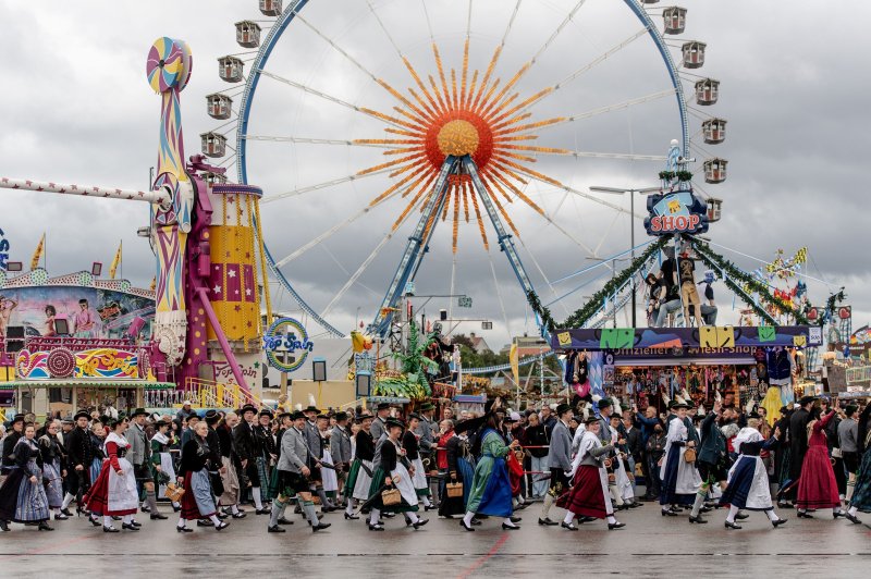People in traditional clothing participate in the costume parade during the 187th edition of the traditional Oktoberfest beer and amusement festival in Munich, Germany, on Sunday. The event was canceled for two years due to the COVID-19 pandemic. Photo by Christian Bruna/EPA-EFE