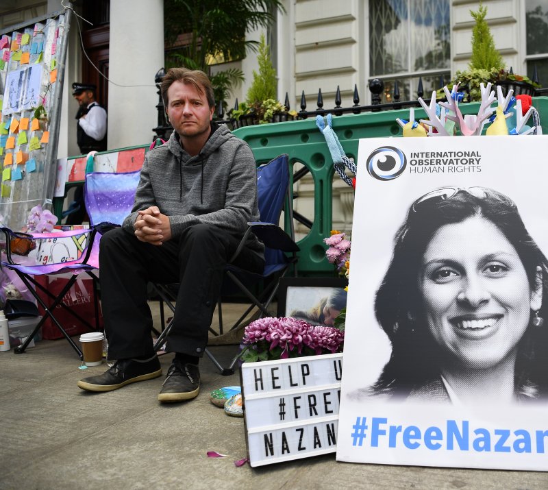 Richard Ratcliffe, the husband of imprisoned Nazanin Zaghari-Ratcliffe, sits outside the Iranian Embassy in London on June 21, 2019. File Photo by Andy Rain/EPA-EFE