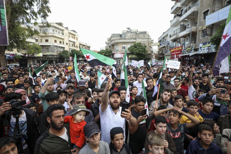 People protest in the opposition-held city of Idlib, Syria, against President Bashar al-Assad's participation in the Arab League summit in Saudi Arabia on May 19. Syrian membership in the organization was suspended after the 2011 war. Photo by Yahya Nemah/EPA-EFE