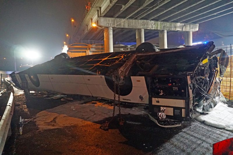 The aftermath of a bus crash Tuesday night that killed at least 21 people, including three children, and injured 15 after the vehicle plunged 50 feet from an overpass near Venice. Photo by Andrea Merola/EPA-EFE