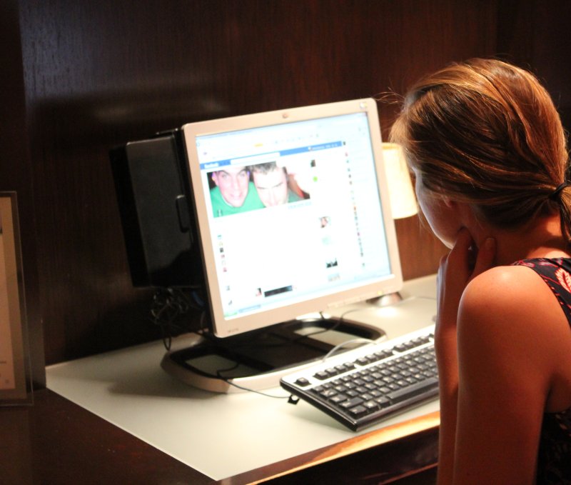 A woman checks her Facebook page in Washington, DC. (File/UPI/Billie Jean Shaw)