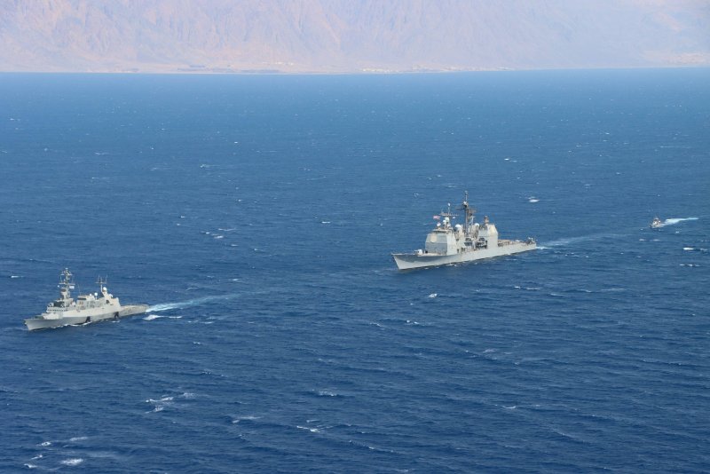 Israeli Navy corvette INS Eilat, L, guided-missile cruiser USS Monterey, center, and an Israeli Navy fast patrol boat transit in formation during a combined maritime security patrol in the Gulf of Aqaba on Tuesday. Photo by Naval Air Crewman 2nd Class Jesse Johnston/U.S. Navy