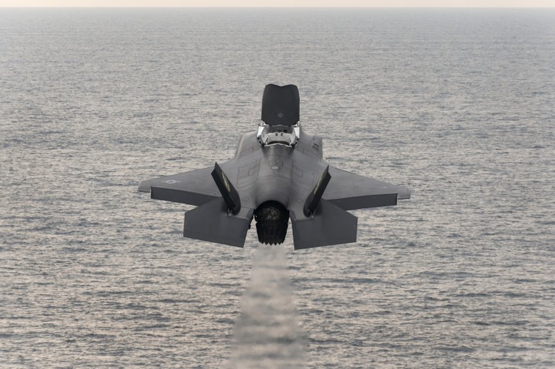 An F-35B test aircraft flies over the Atlantic ocean just after taking off from the USS Wasp on Aug. 23, 2013. Lockheed Martin CEO Marillyn Hewson promised to cut the cost of the F-35 after speaking with President-eleect Donald Trump. Trump had been critical of the aircraft's price, but Hewson promised her "personal commitment" to have it driven down. Photo courtesy Lockheed Martin