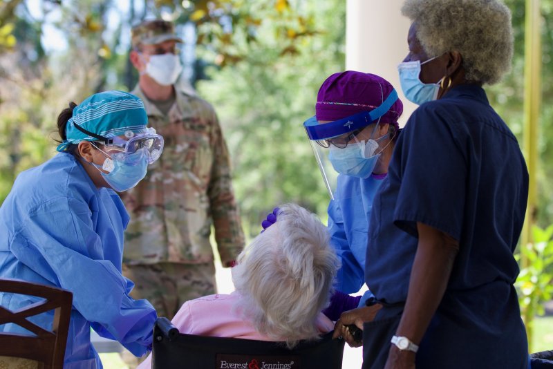Registered nurses with the Florida Department of Health perform a specimen collection on a patient at a Northeast Florida nursing home, May 1, 2020. Researchers found that of COVID-19 patients admitted to a New York hospital between March and May, just over 70% were given antibiotics. Photo by Sgt. Michael Baltz/Flickr
