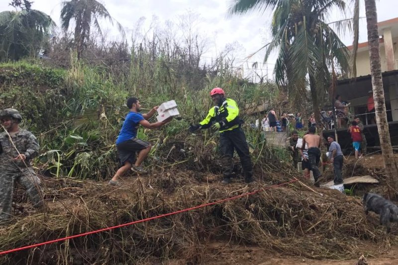 New York Task Force 1 assisted the Puerto Rico National Guard on Wednesday in delivering water and food to an isolated community in Puerto Rico after Hurricane Maria. Photo courtesy FEMA/Twitter