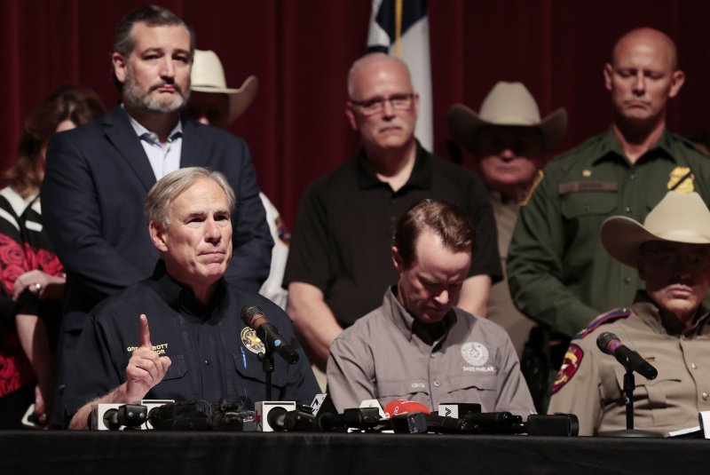 Texas Gov. Greg Abbott (L) speaks during a news conference Wednesday on a mass shooting at Robb Elementary School in Uvalde, Texas, that killed 19 children and two adults. Photo by Aaron M. Sprecher/EPA-EFE