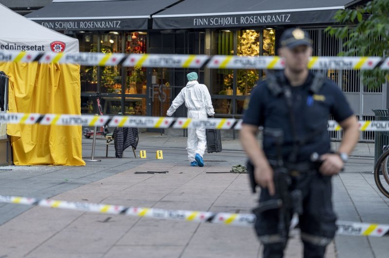 Police investigate the scene after several shots were fired outside the London Pub in the center of Oslo, Norway, on Saturday. Photo by Javad Parsa/EPA-EFE