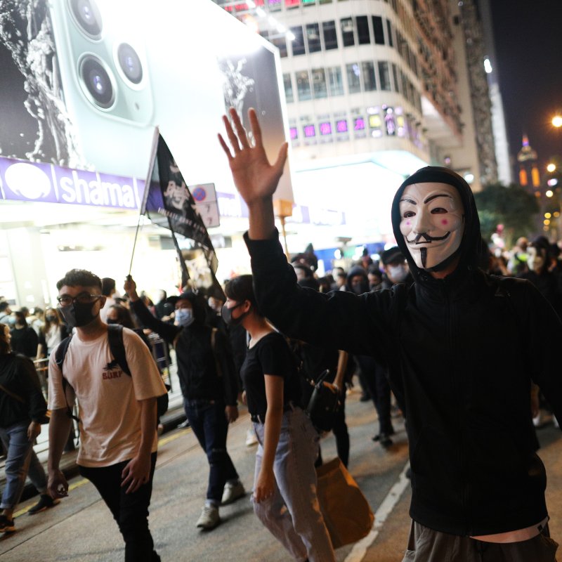 Hong Kong protesters don Guy Fawkes masks to mark month since mask ban
