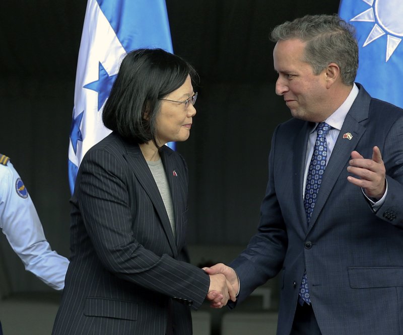Tsai Ing-wen, the president of Taiwan, is welcomed by Honduran presidential nominee Ricardo Alvarez (R) after her arrival at Palmerola Air Base in Honduras in January 2017. File Photo by Gustavo Amador/EPA