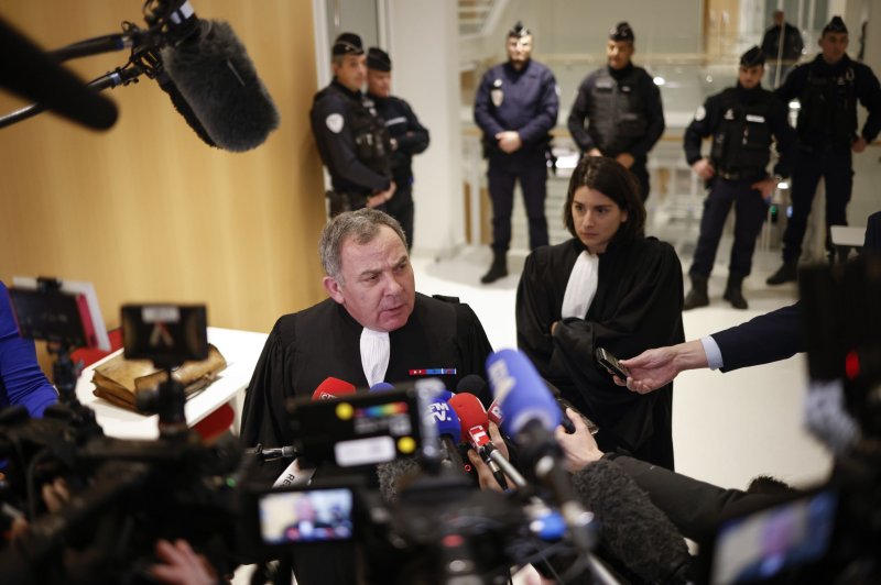 French lawyer Francis Spizner, representing the family of terrorism victim Samuel Paty, talks to the media on Friday after hearing the guilty verdicts for six minors on trial for their involvement in the murder of the teacher in 2020. Photo by Yoan Valat/EPA-EFE