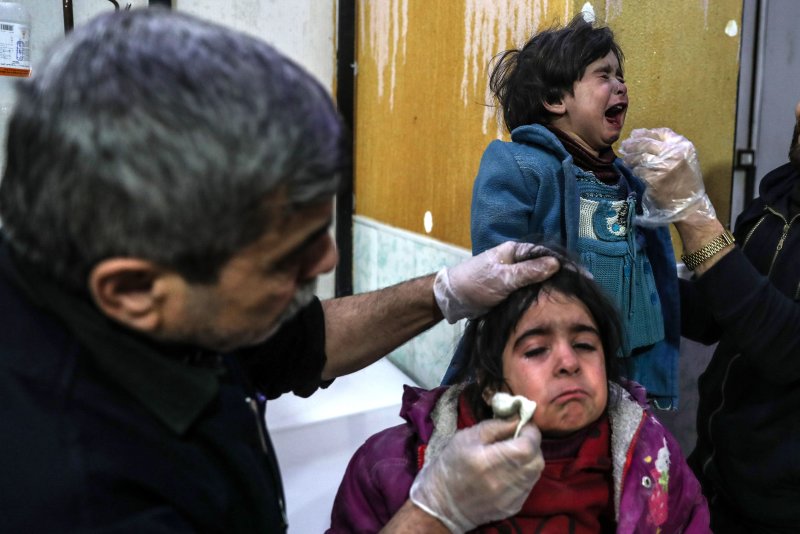 Injured children receive medical attention inside a hospital Thursday after bombings in rebel-held Douma, Eastern Ghouta. The U.N. Security Council on Saturday adopted a resolution calling for a 30-day cease fire for delivery of delivery of emergency aid. Photo by Mohammed Bada/EPA