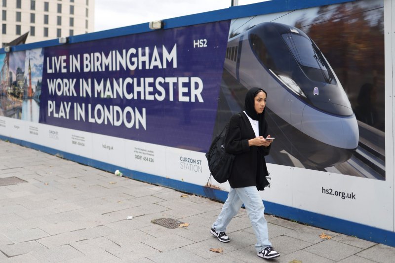 Construction hoarding in downtown Birmingham extols the benefits of Britain's $121 billion HS2 high-speed rail project linking London with the north for which the key Birmingham to Manchester section was axed Wednesday. Photo by Neil Hall/EPA-EFE