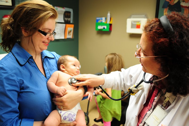 A survey of doctors who are also mothers found women report being passed over for raises and leadership positions, had contracts be shortened or end after returning from maternity leave, and experienced higher and lower performance expectations as a result of their gender. Photo by 2nd Lt. Victoria Lalich/U.S. Air Force