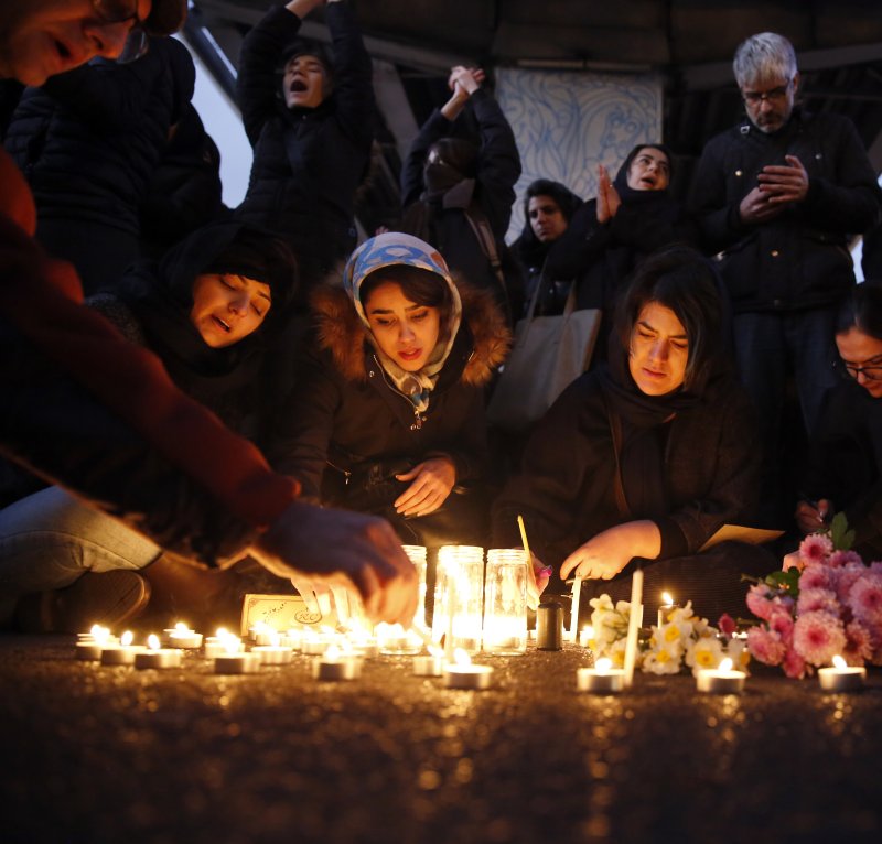 Iranians light candles for victims of Ukraine International Airlines Boeing 737-800 during as they protest in front of the Amir Kabir University in Tehran, Iran, on January 11, 2020. File Photo by Abedin Taherkenareh/EPA-EFE