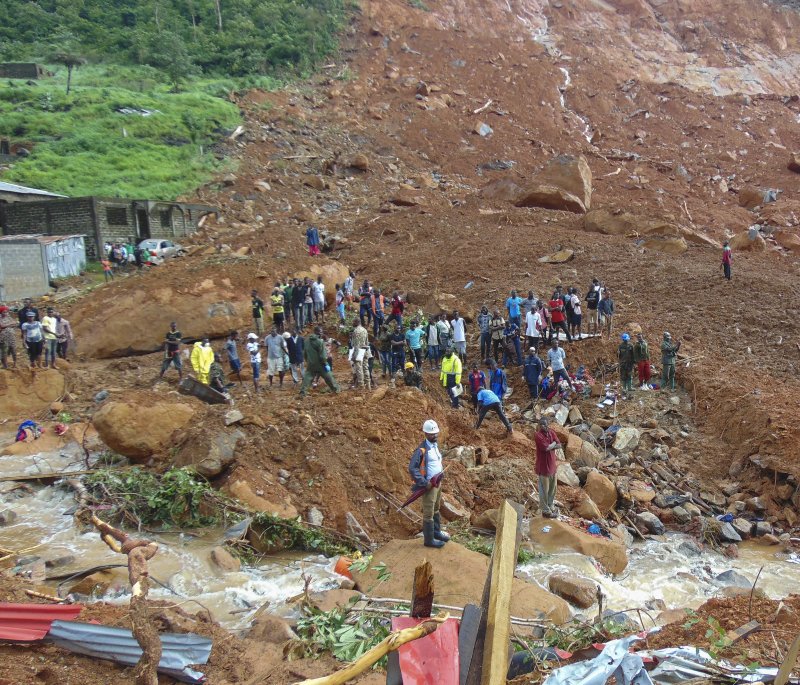 Residents view damage caused by a mudslide in the suburb of Regent behind Guma reservoir, Freetown, Sierra Leone, on August 14, 2017. File Photo by Ernest Henry/EPA