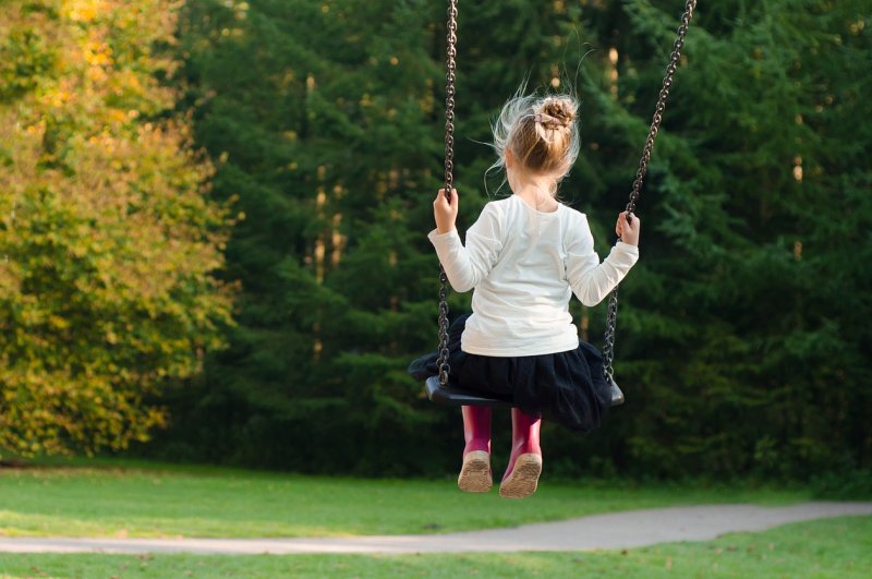 Lack of fitness could put kids at greater risk of suffering heat-related health problems, such as dehydration, heat cramps, heat exhaustion or heat stroke, researchers say. Photo by Skitterphoto/<a href="https://pixabay.com/photos/girl-swing-rocking-autumn-fall-996635/">Pixabay</a>
