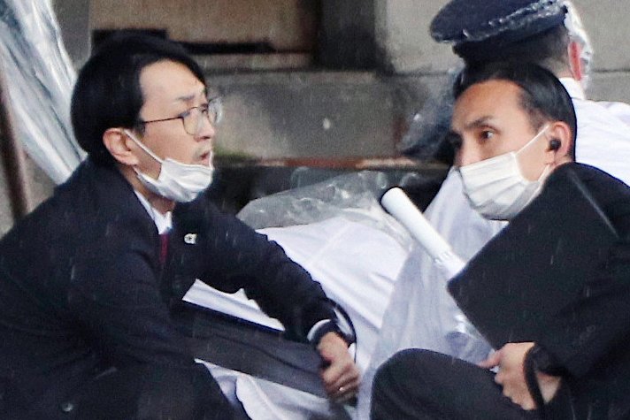 Police officers arrest a man suspected to have thrown explosives as Japanese Prime Minister Fumio Kishida was about to make a stump speech at a fishing port in Wakayama Prefecture, Japan, on Saturday. Photo by Jiji Press/EPA-EFE